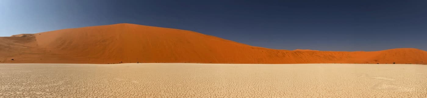 a large sand dune in the middle of a desert